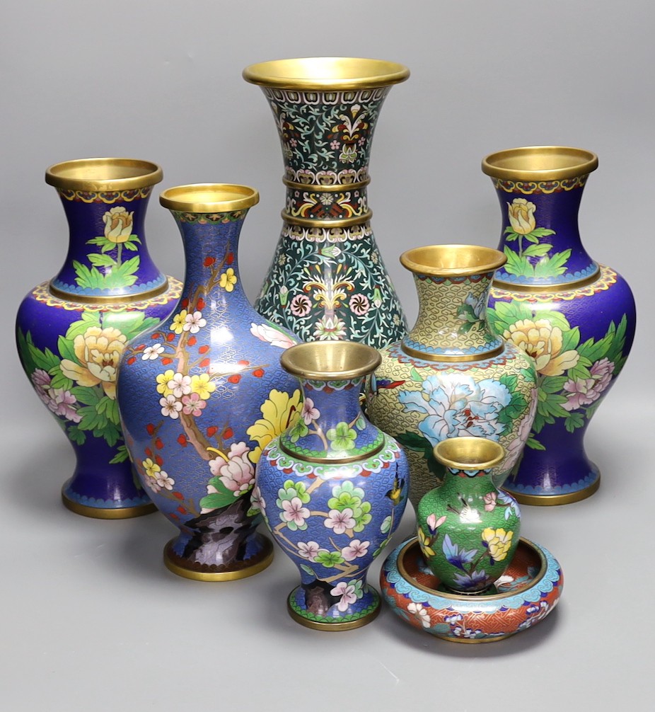 Seven Chinese cloisonné enamel vases and a bowl, tallest 39 cms high